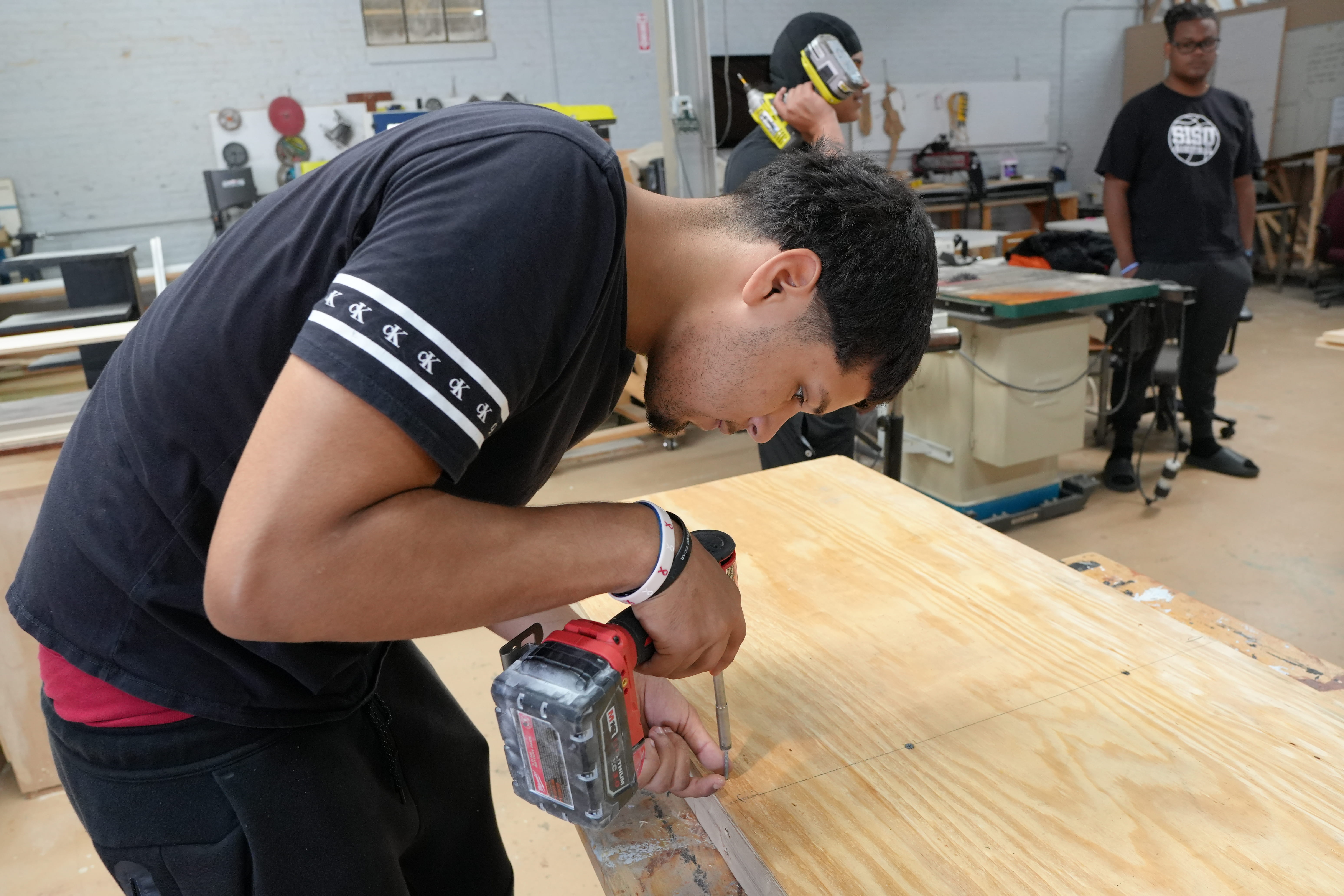 Youth learning woodworking skills